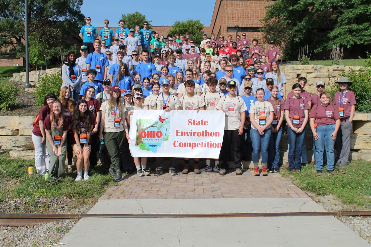A group photo of participants at the Ohio Envirothon State Competition holding a banner.