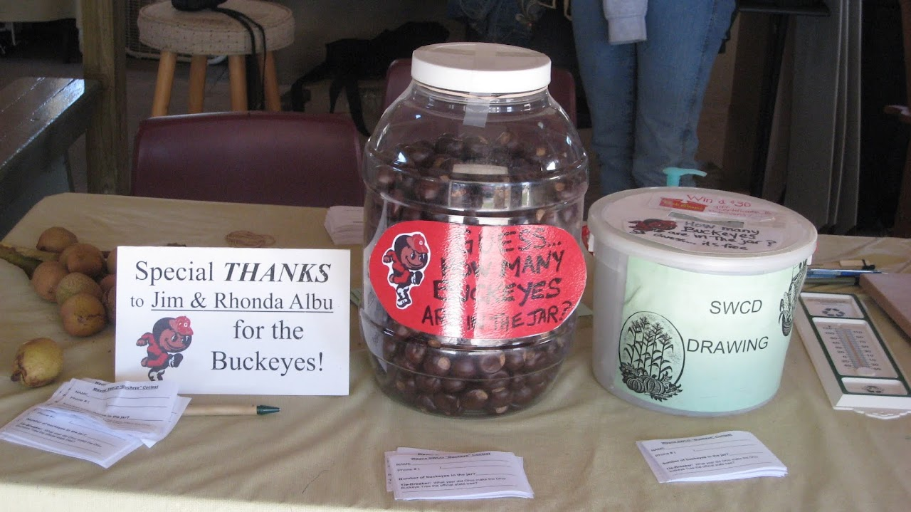 Jar of buckeyes for a guessing game, SWCD drawing bucket, and a thank you note to Jim & Rhonda Albu.