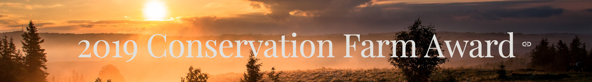 Sunset over a scenic landscape with the text "2019 Conservation Farm Award."
