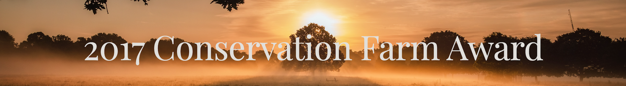 Sunset over a farm landscape with text: "2017 Conservation Farm Award".