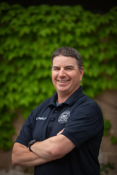 Engineer Erik Padilla smiling with arms crossed