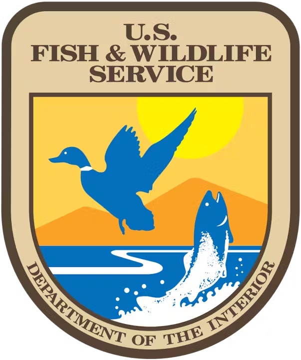 U.S. Fish & Wildlife Service emblem with a bird, fish, sun, and water.