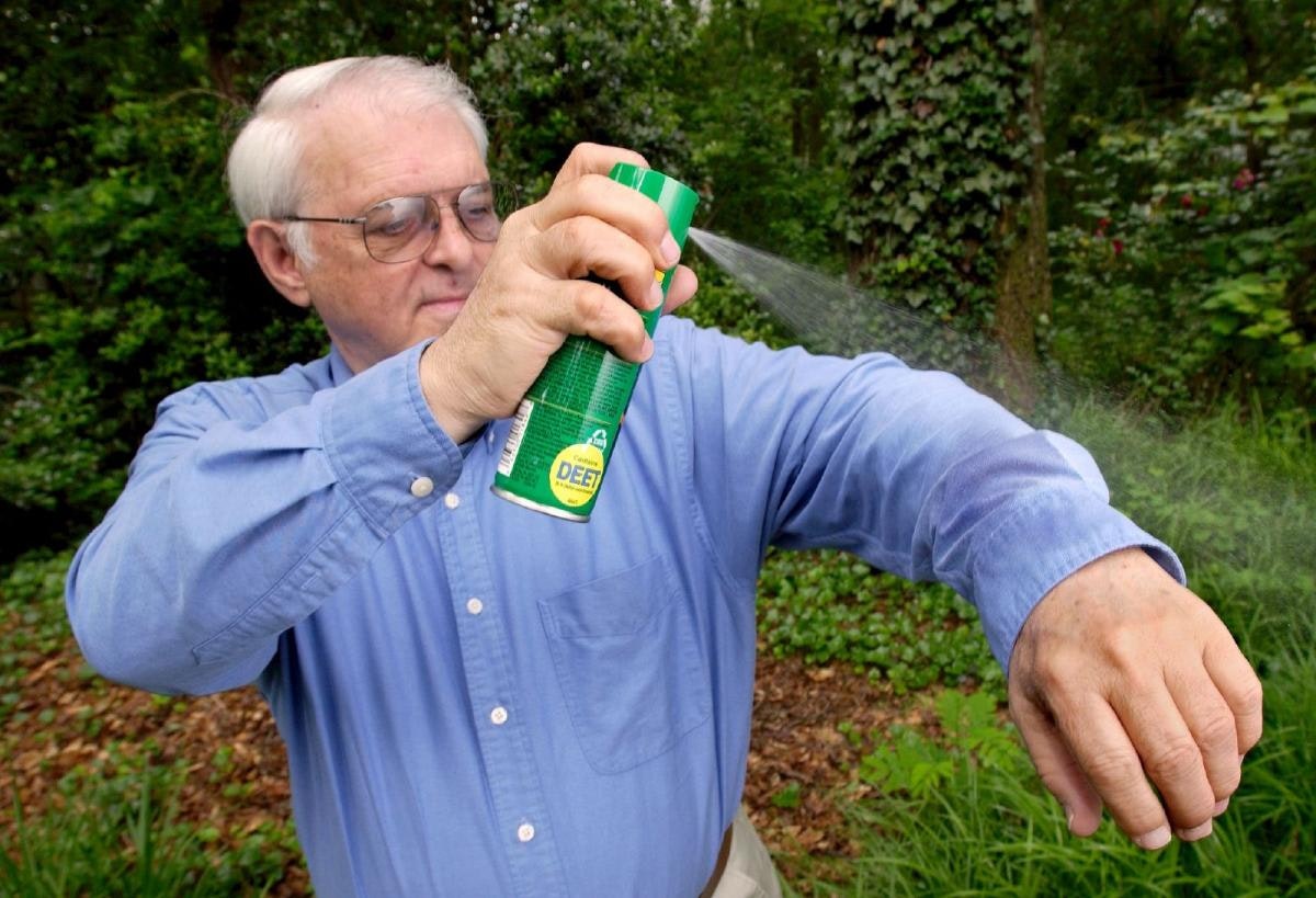 May contain: grass, plant, garden, nature, outdoors, adult, male, man, person, vegetation, can, tin, face, and head