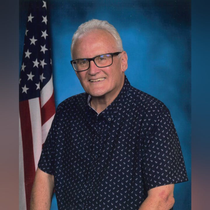 May contain: person, human, glasses, accessories, accessory, flag, and symbol