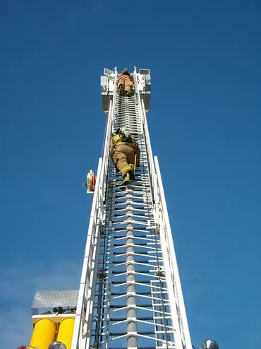 May contain: firetruck, ladder, firefighter