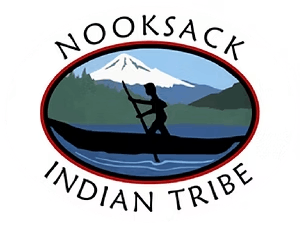 Nooksack Indian Tribe logo: silhouette of a person paddling a canoe on water with mountains in the background.