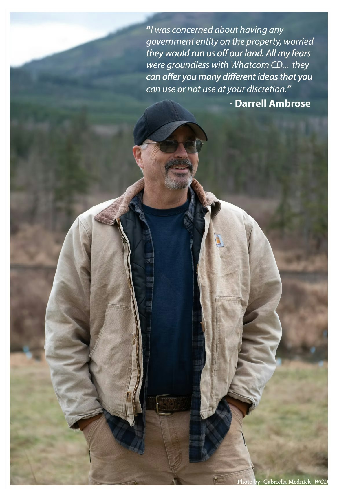 Man outdoors with a positive testimonial about Whatcom CD offering support, wearing a jacket and cap.