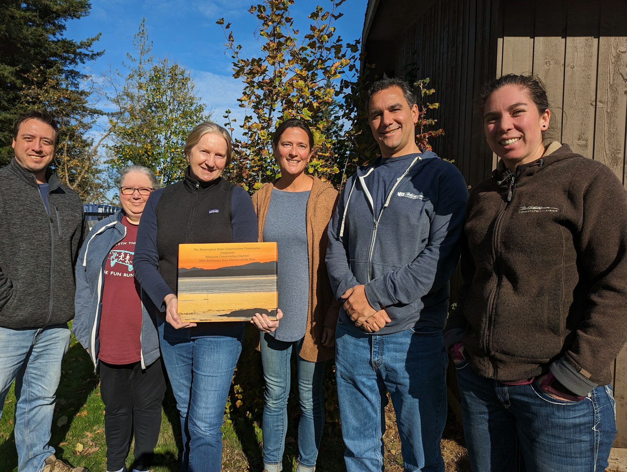 Some Whatcom CD staff members pose with the 2023 Northwest Area District of the Year Award