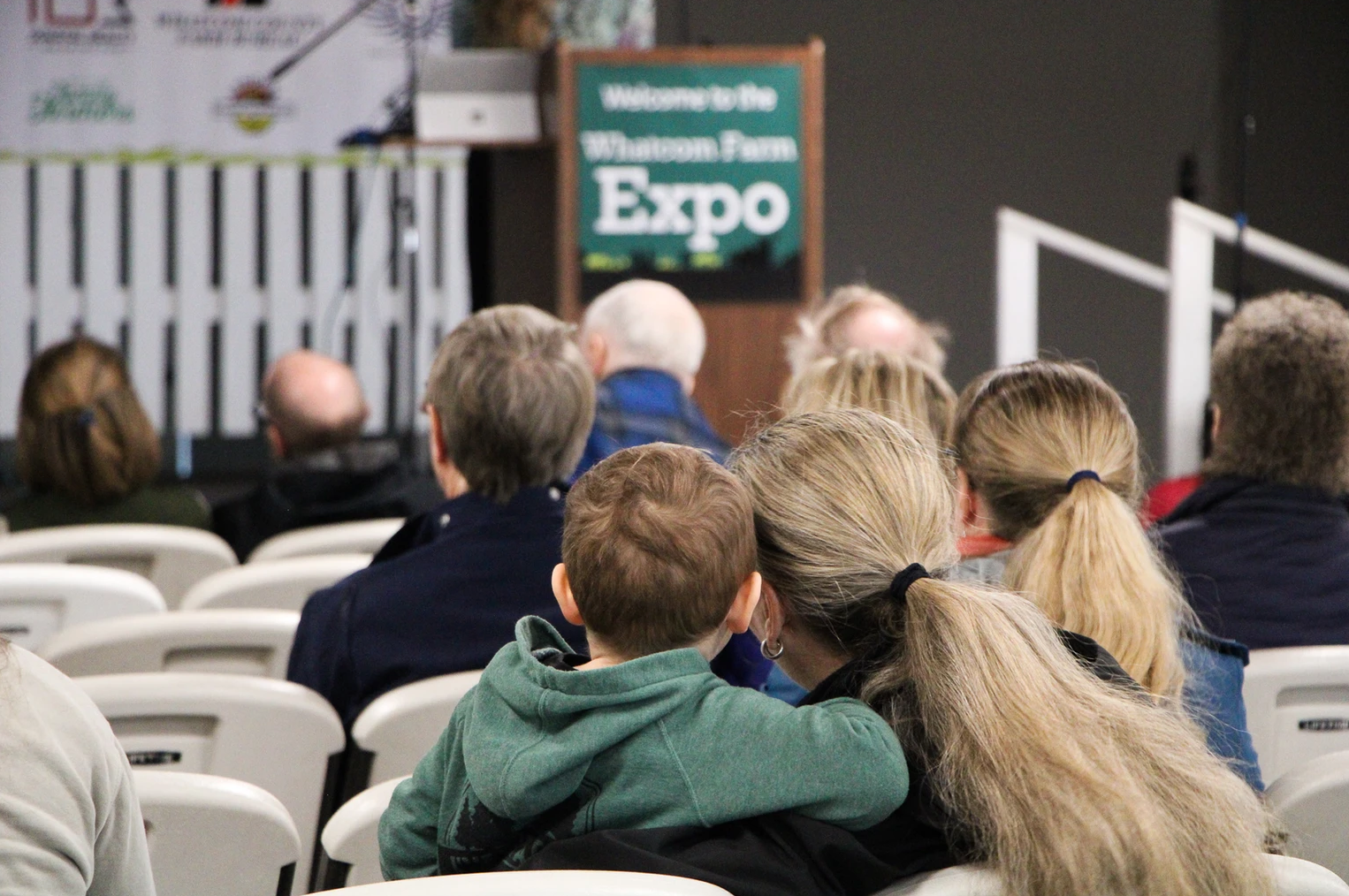 People seated and listening at the Whatcom Farm Expo.
