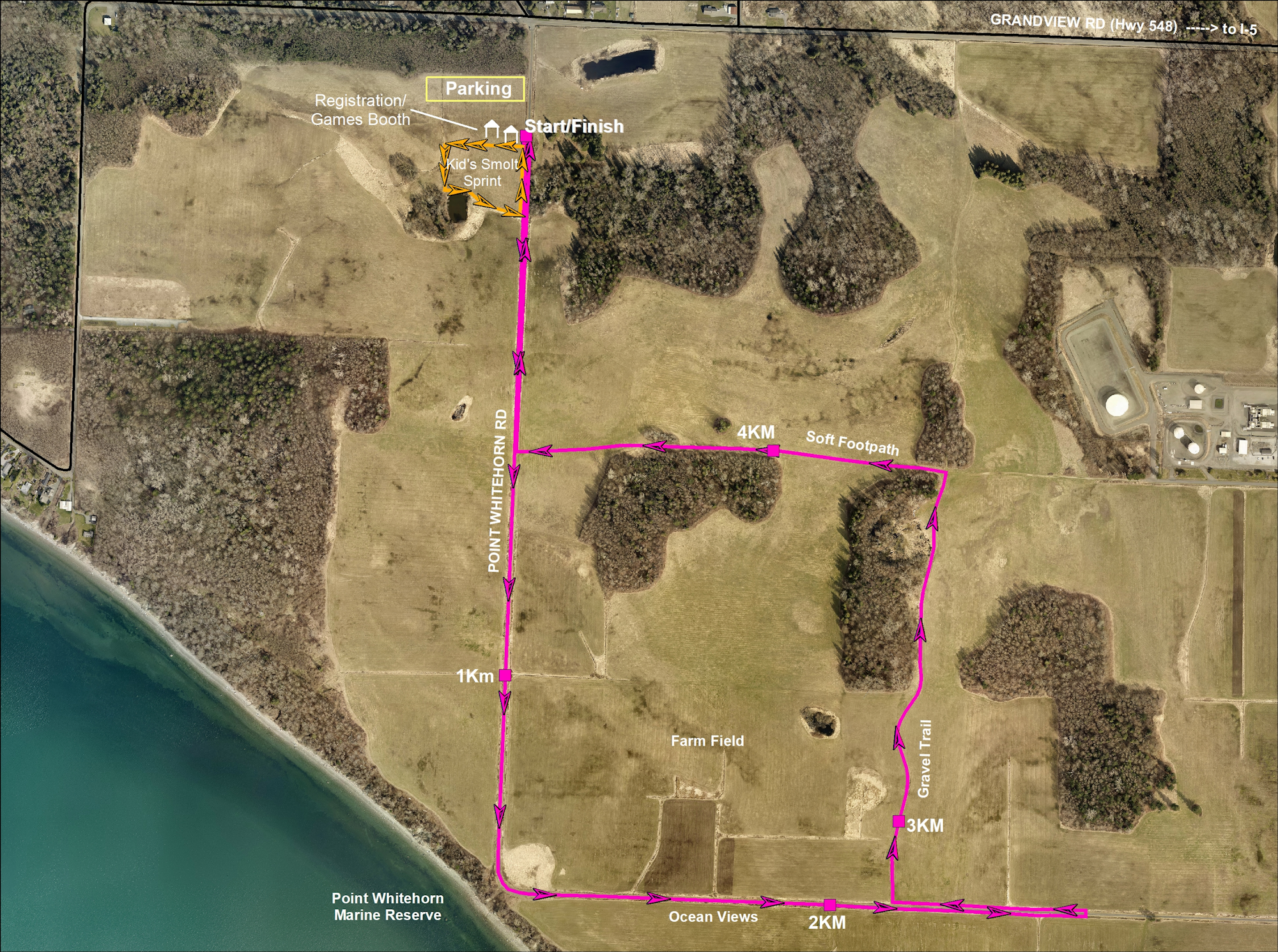 Aerial view of a running route with start/finish, parking, children's sprint, and ocean views. Paths marked with distances and terrain.