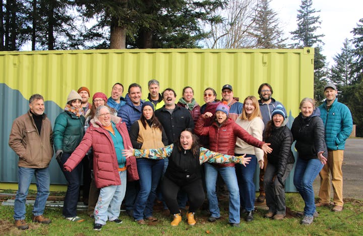 May contain: clothing, pants, people, person, groupshot, adult, female, woman, coat, jacket, footwear, shoe, male, man, jeans, accessories, glasses, hat, and glove