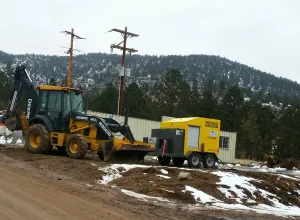 Photo of a bulldoser and a building