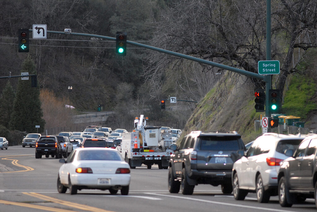 May contain: traffic light, light, truck, transportation, vehicle, car, automobile, wheel, machine, and road