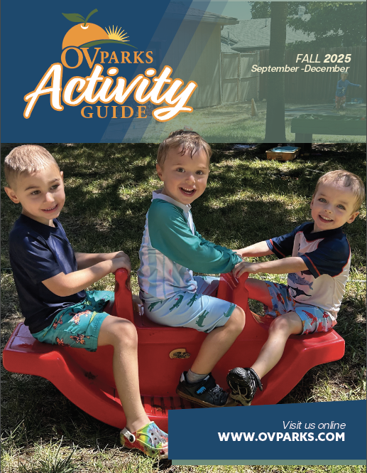 Three children playing on a red seesaw outdoors, featured on the cover of the OV Parks Fall 2025 Activity Guide.