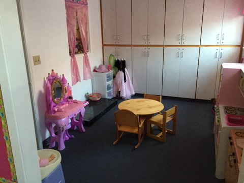 May contain: dressing room, indoors, room, chair, furniture, desk, table, person, hat, and clothing