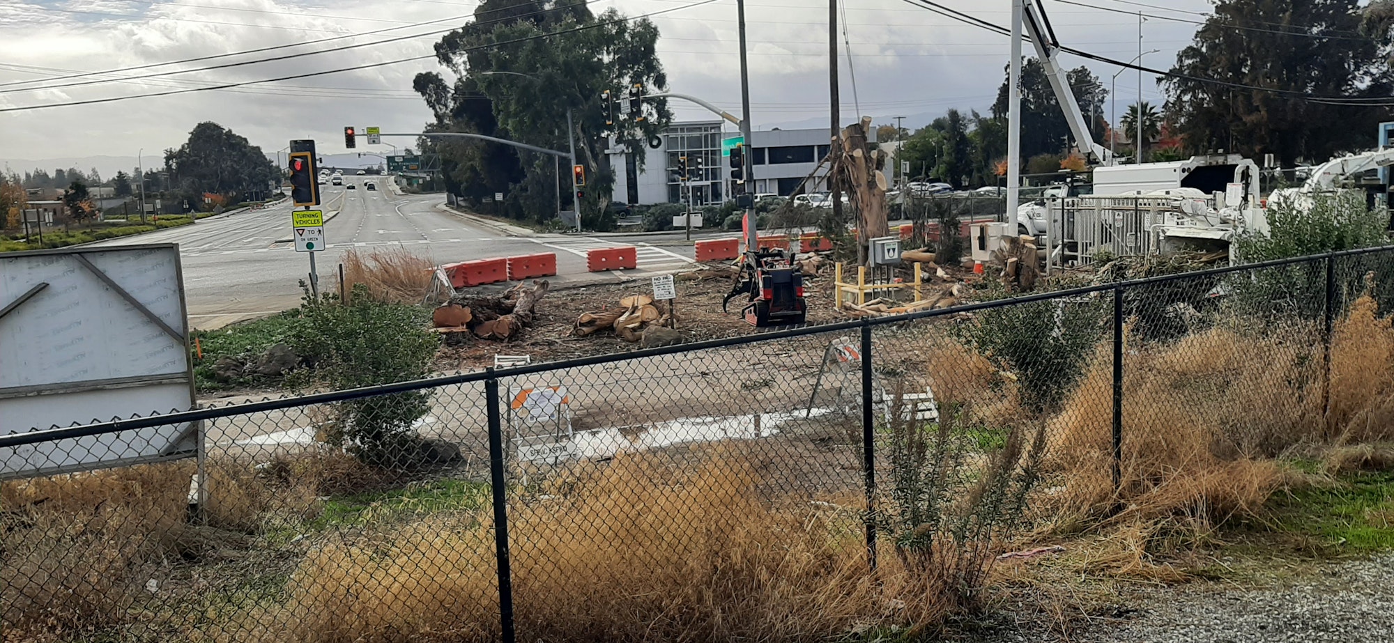 May contain: utility pole, light, traffic light, road, outdoors, and city