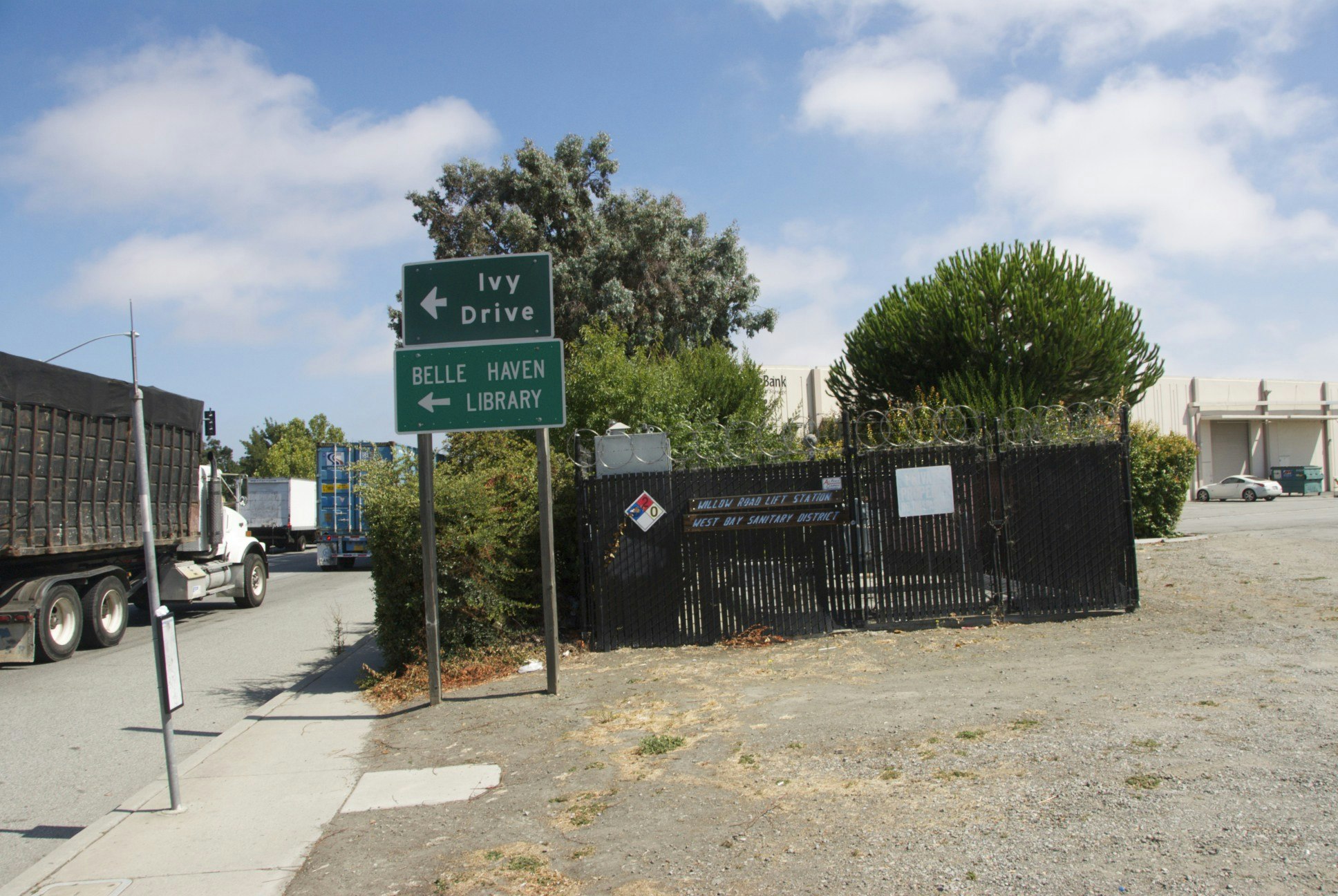 May contain: transportation, truck, vehicle, road, sign, symbol, car, and gate