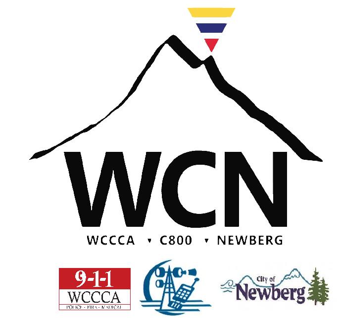 Logo for WCN with a mountain, WCCCA, C800, and Newberg symbols, including a 9-1-1 emblem and communication equipment icon.