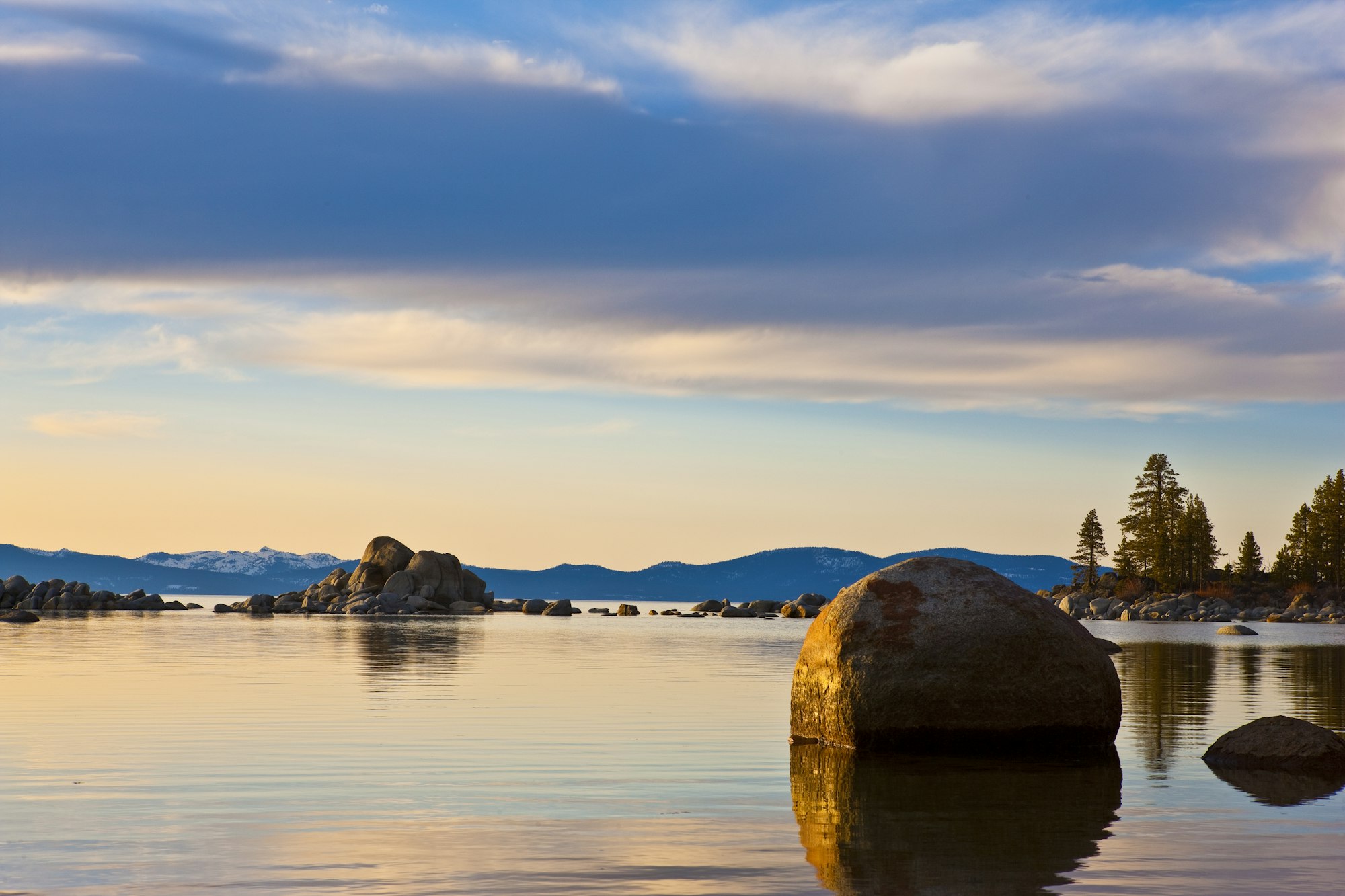 May contain: land, nature, outdoors, sea, water, lake, scenery, promontory, sky, shoreline, coast, fir, plant, and tree