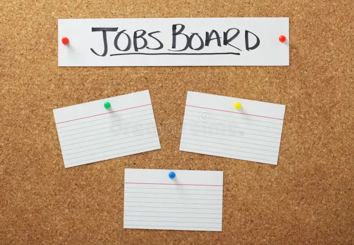 A corkboard labeled "JOBS BOARD" with three blank index cards pinned on it, typically used for posting job listings.