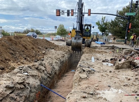 Crane digs out pipeline to allow for replacement under Yorkshire Dr.