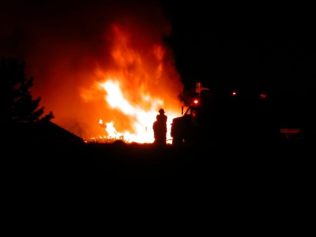 May contain: fire, bonfire, flame, person, and human