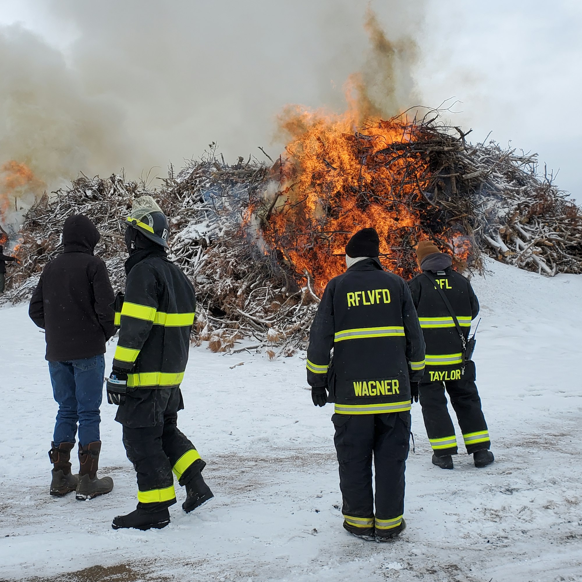 May contain: clothing, glove, person, fire, footwear, shoe, hoodie, knitwear, sweater, and sweatshirt