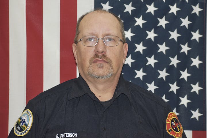 May contain: person, man, adult, male, glasses, accessories, captain, officer, police officer, face, and head