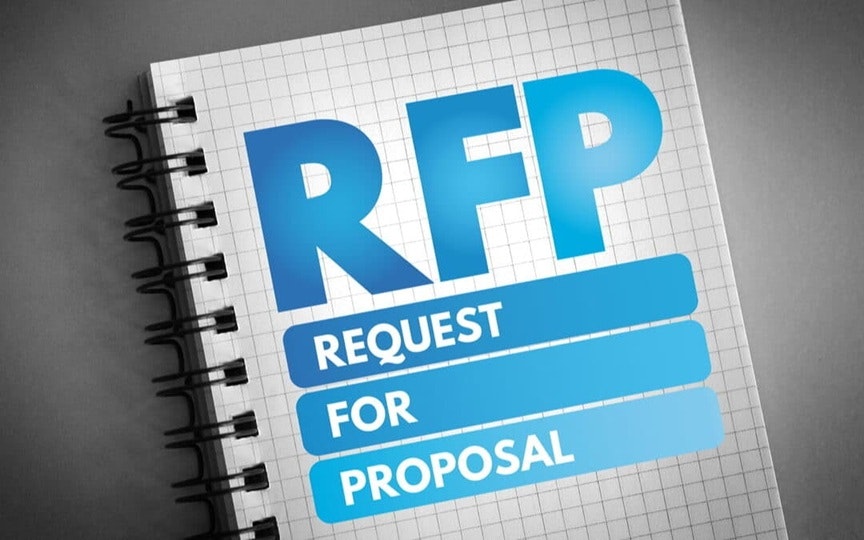 The image shows a notepad with "RFP" (Request for Proposal) prominently displayed.