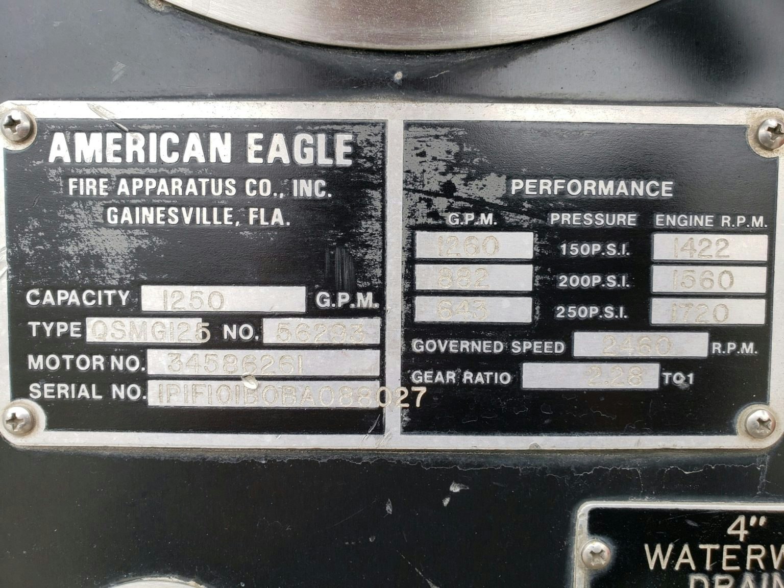 American Eagle fire apparatus data plate: capacity, motor and serial numbers, performance specs, gear ratio.