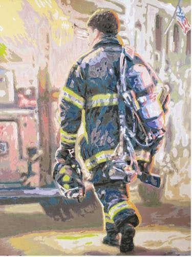 A firefighter in gear walking by a fire truck, American flag in the background.