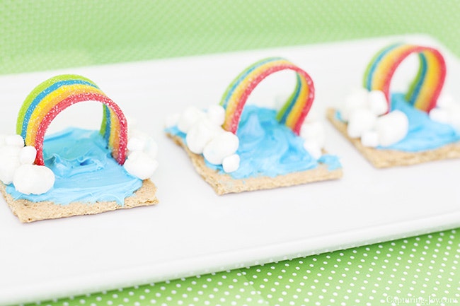 Rainbow weather snack; graham cracker with blue frosting, mini marshmallow clouds and airheads extremes rainbow