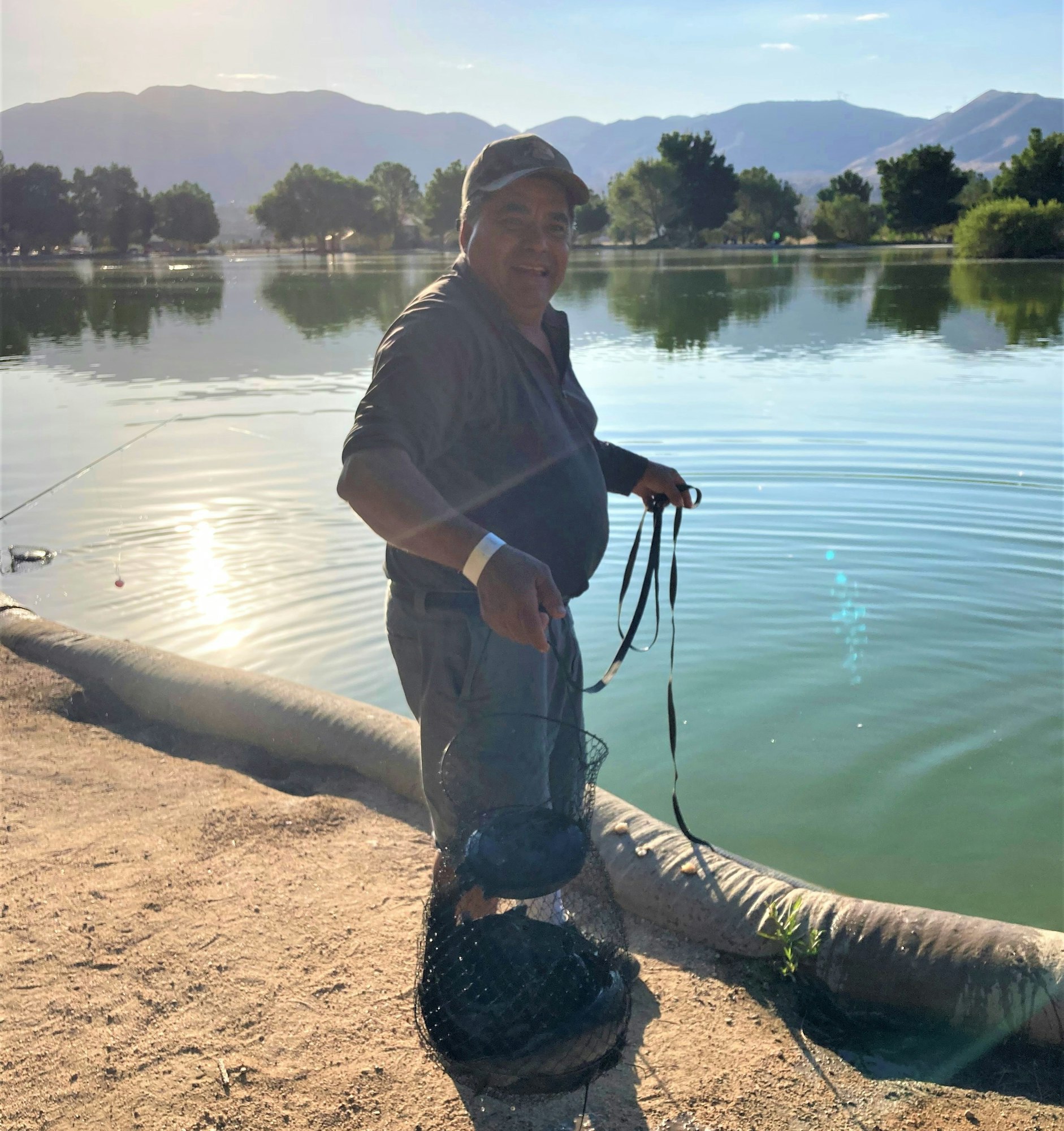 May contain: water, outdoors, person, human, and fishing