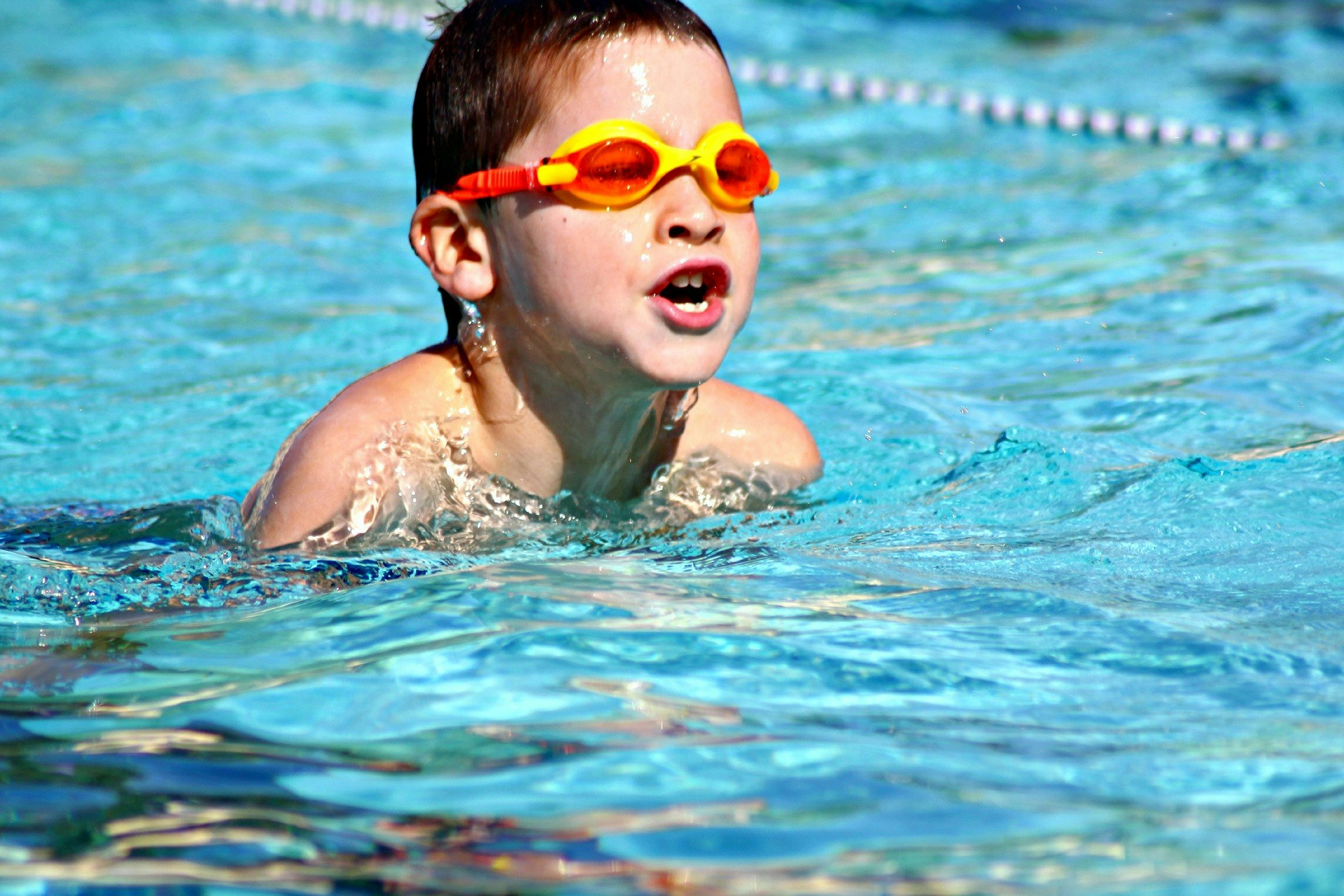May contain: human, sports, water, sport, person, swimming, sunglasses, accessories, accessory, and goggles