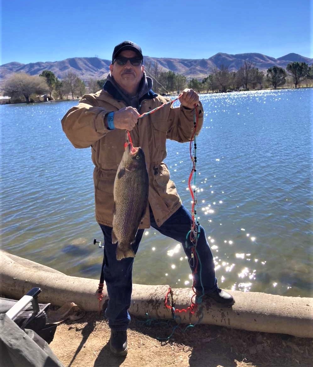 May contain: person, human, water, outdoors, trout, animal, and fish