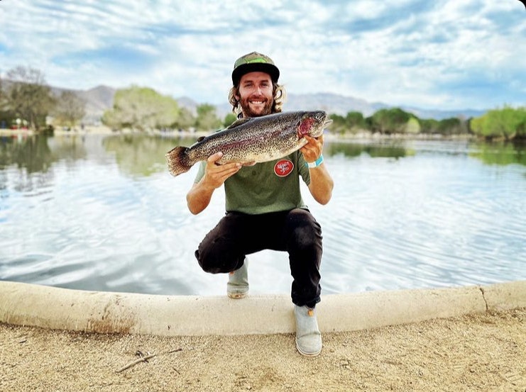 May contain: trout, fish, animal, person, human, outdoors, nature, and water
