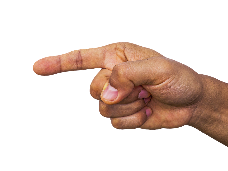 Close up of a hand pointing to the left