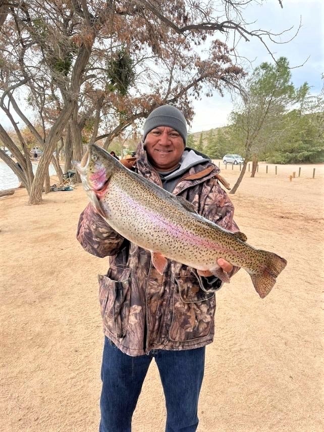 May contain: fish, sea life, animal, portrait, person, photography, head, face, hat, clothing, trout, and outdoors