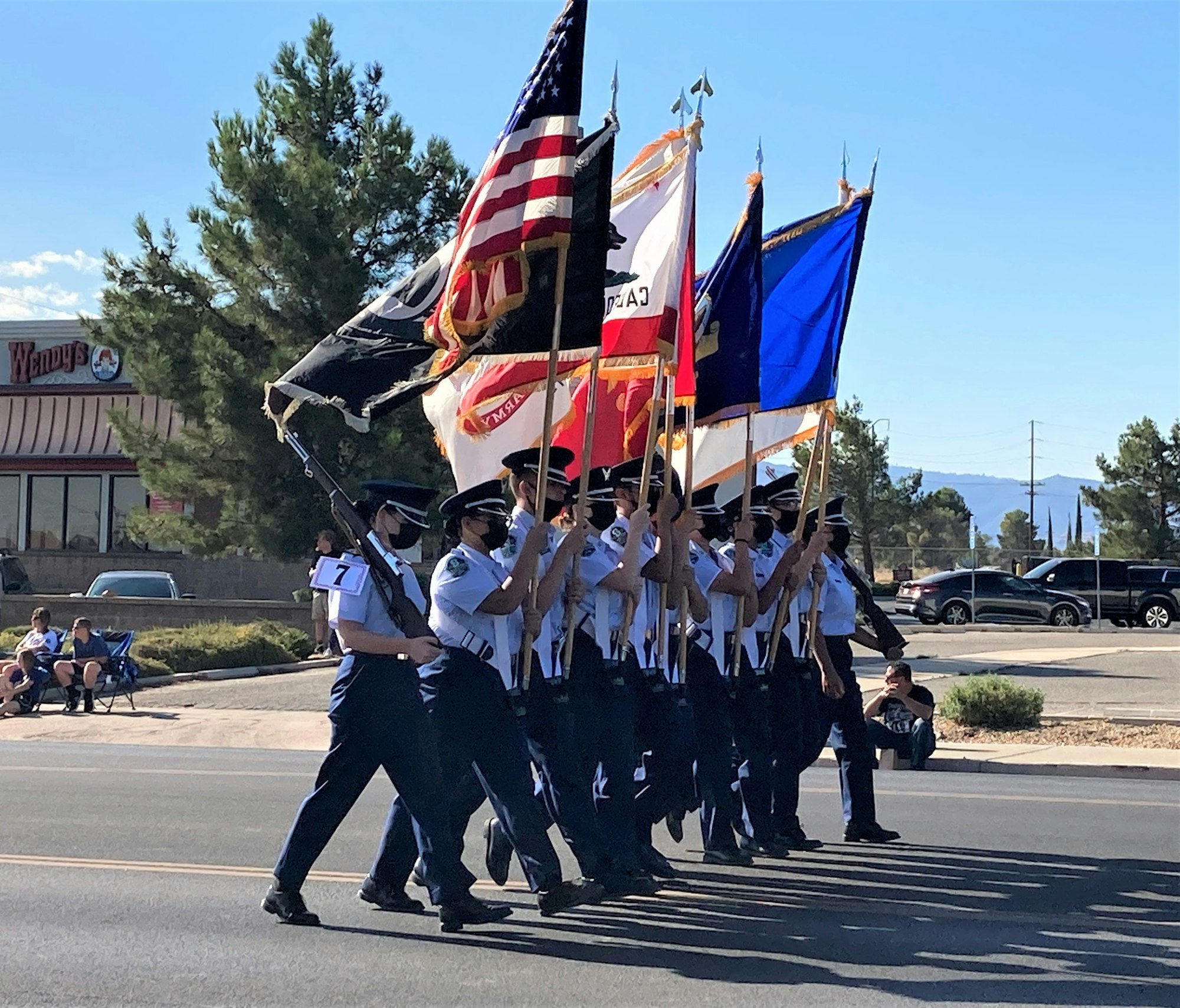 May contain: person, human, marching, crowd, flag, and symbol