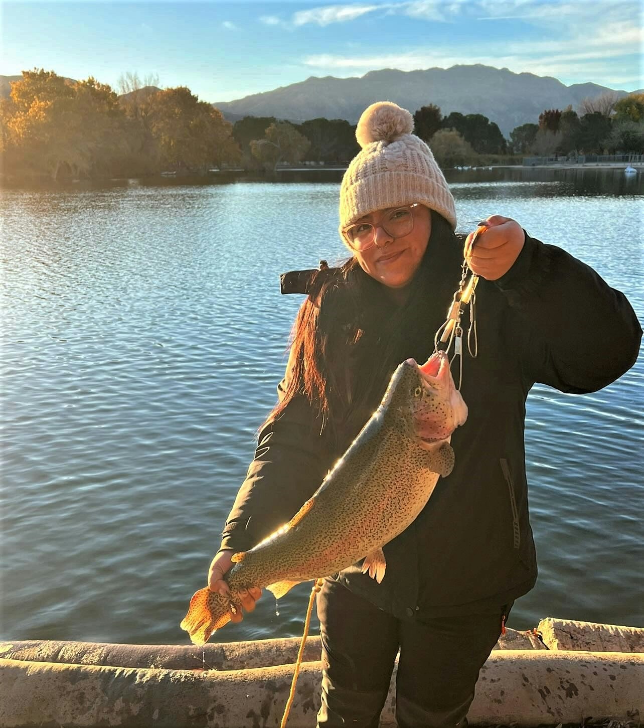 May contain: portrait, photography, person, head, face, lake, outdoors, water, nature, fishing, leisure activities, trout, sea life, fish, animal, and waterfront