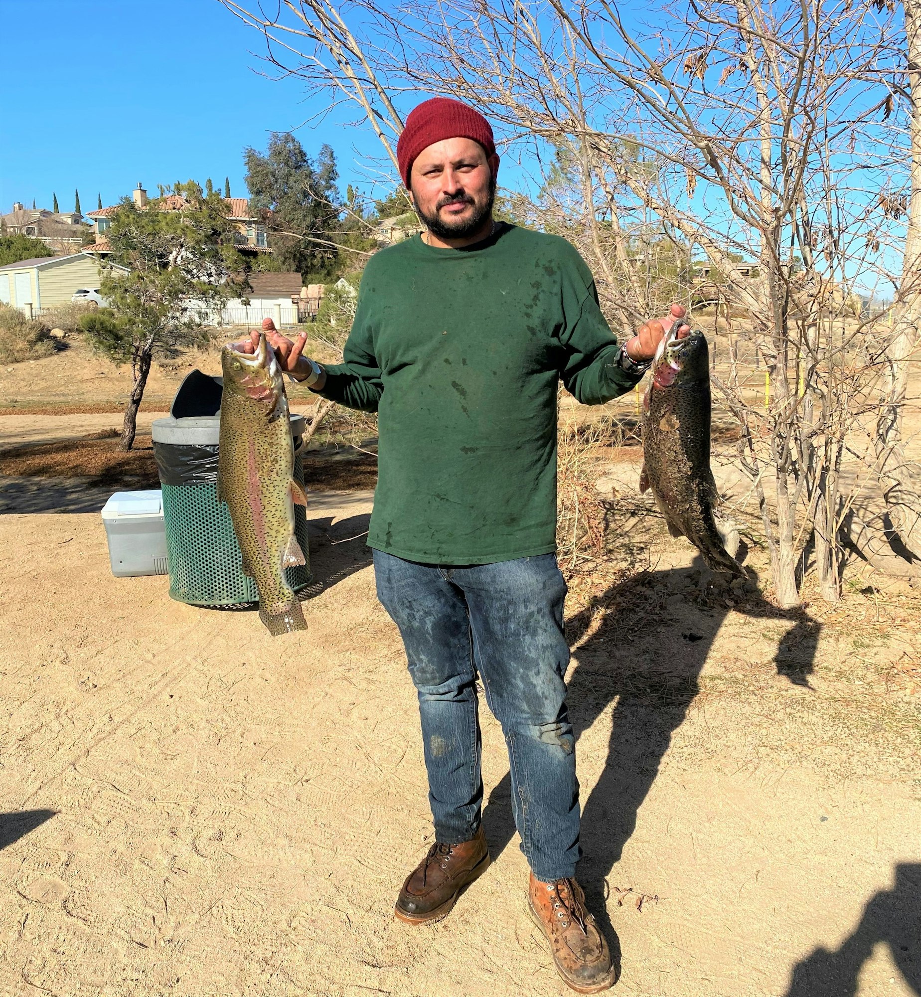 May contain: pants, clothing, portrait, photography, person, head, face, soil, jeans, fish, sea life, animal, man, adult, male, box, standing, trout, shoe, footwear, bonito, tuna, and outdoors