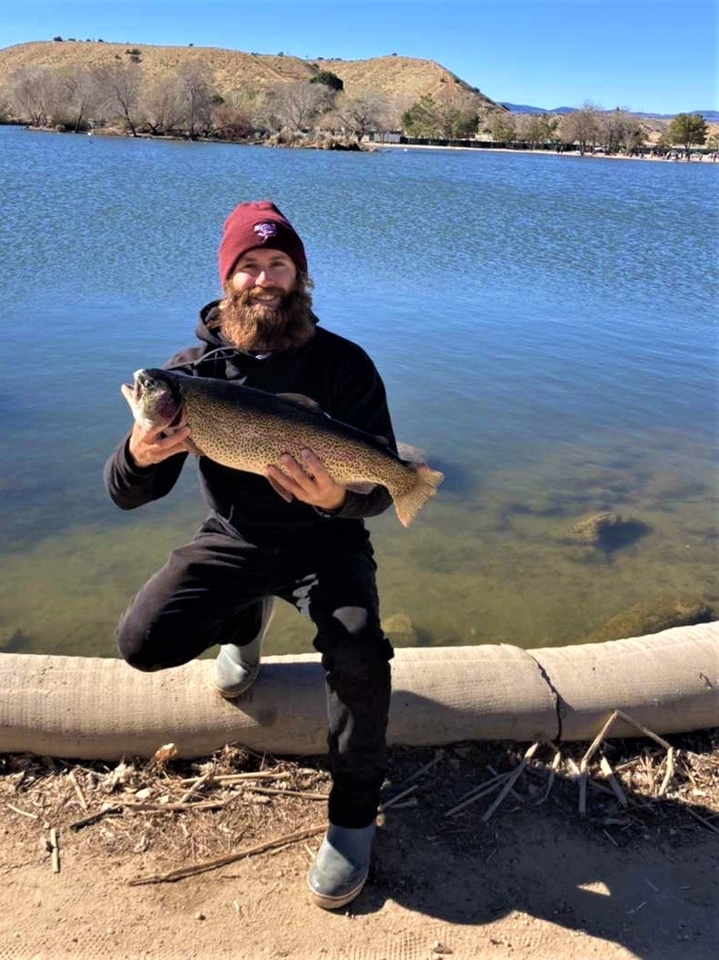 May contain: trout, fish, animal, person, human, and coho