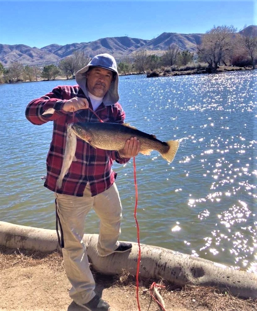 May contain: person, human, water, outdoors, trout, animal, and fish