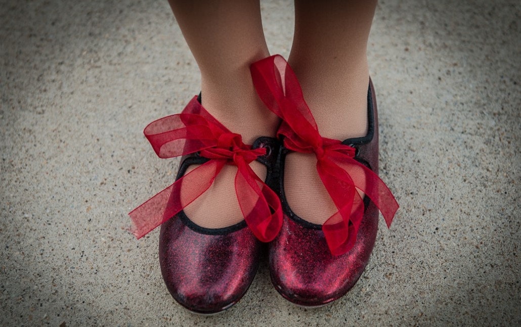 Red tap shoes with red ribbon bows