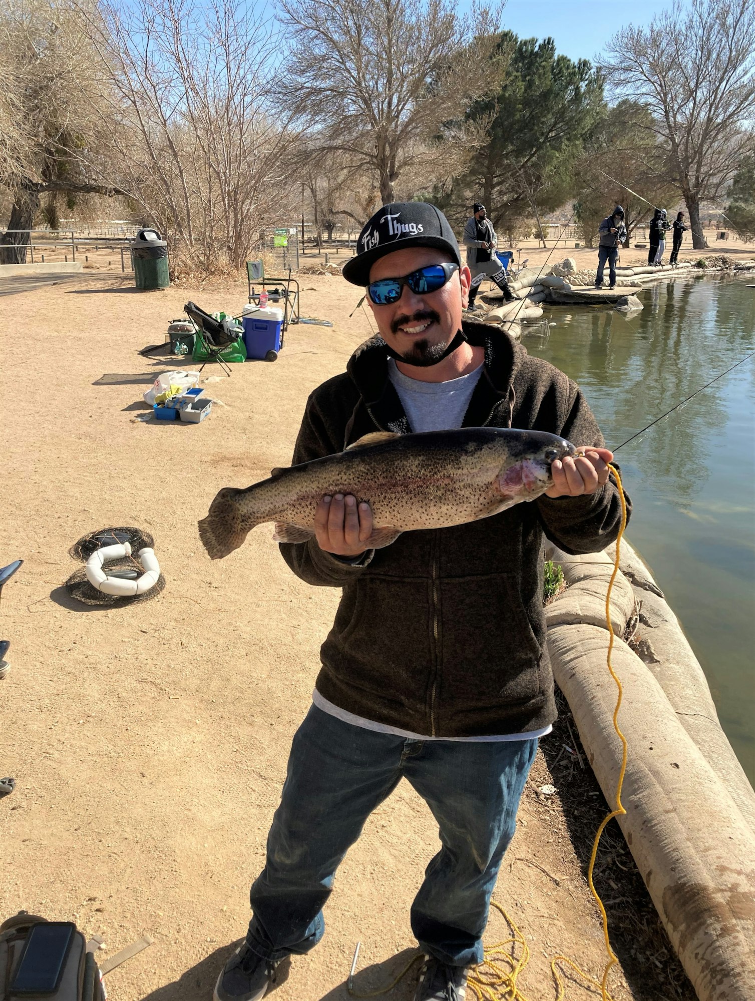 May contain: person, human, sunglasses, accessories, accessory, coho, fish, animal, and trout