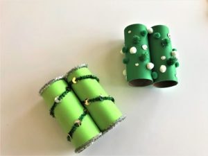 Binoculars made from paper rolls designed with green paint, green pipe cleaners and green pom poms