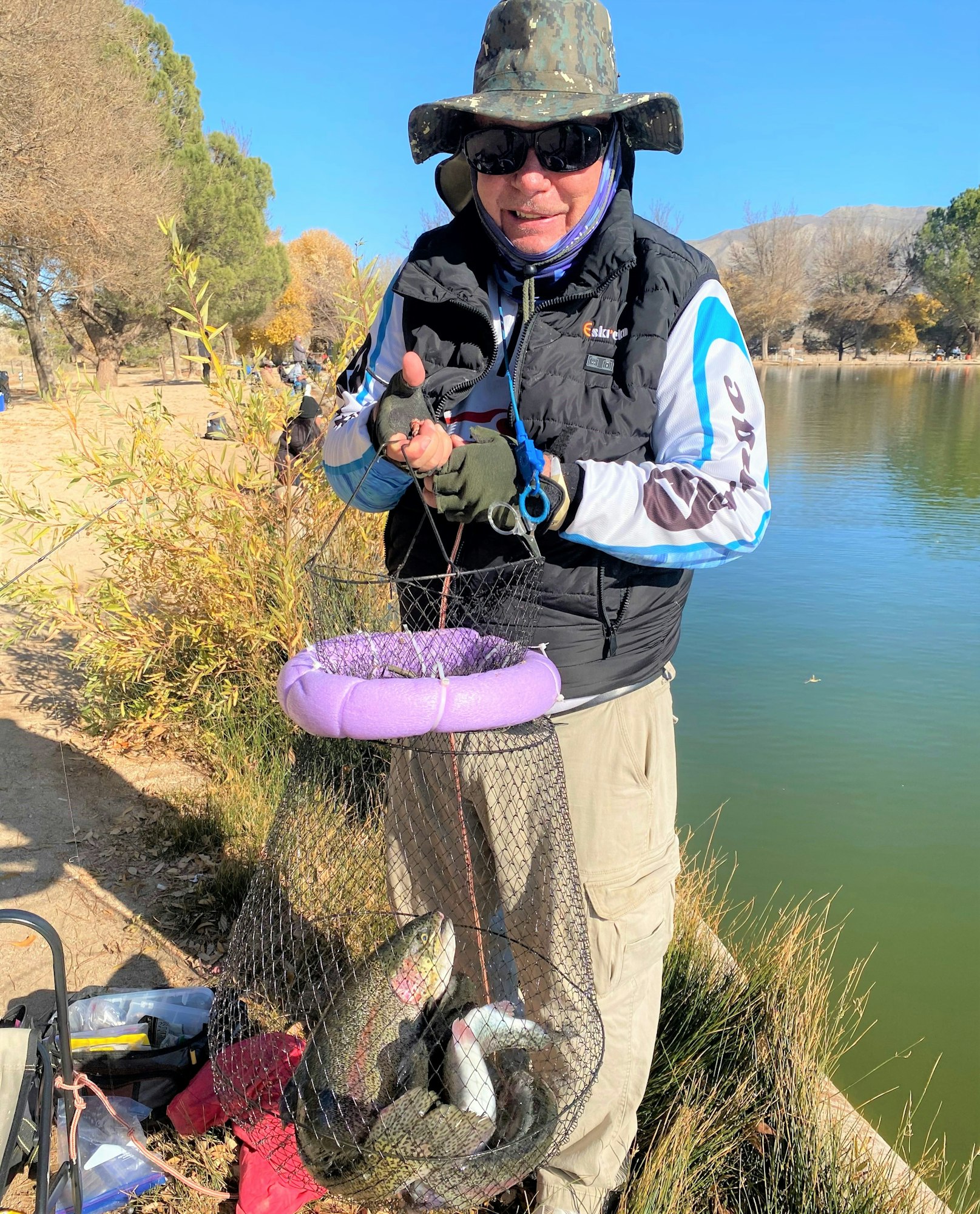 May contain: fishing, outdoors, water, leisure activities, photography, glove, clothing, person, portrait, head, face, glasses, accessories, and angler