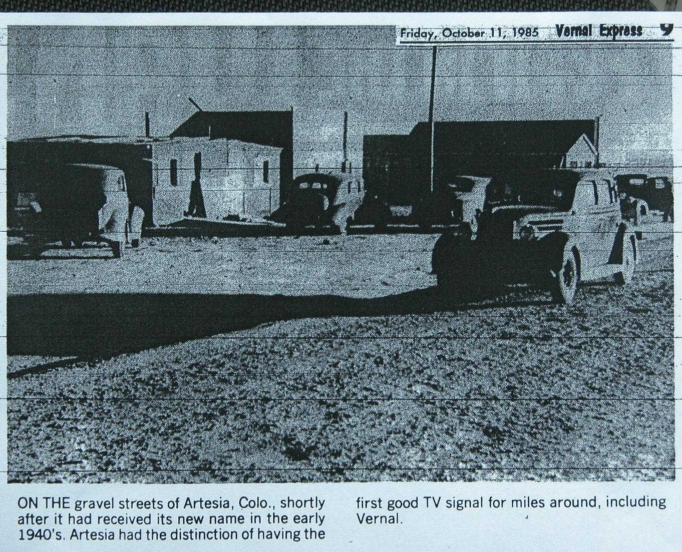 Historic newspaper photo from 1985: 1940s Artesia, Colo., showing vintage cars, buildings, and text about early TV signals.