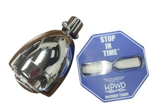 A showerhead and a "Stop in Time" HPWD shower timer with an hourglass design beside it.