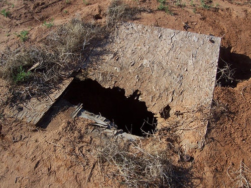 May contain: architecture, building, outdoors, shelter, bunker, and hole